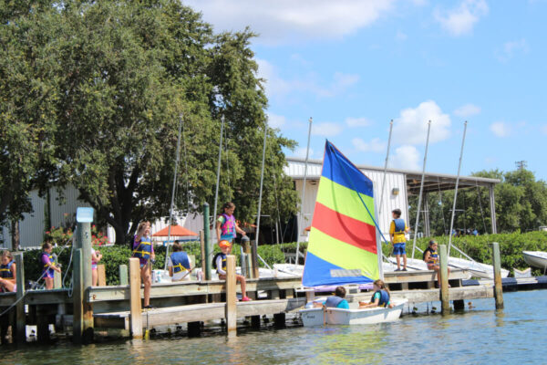 Boathouse Children using sailboats while learning to sail at watersports camp in St. Petersburg, Florida